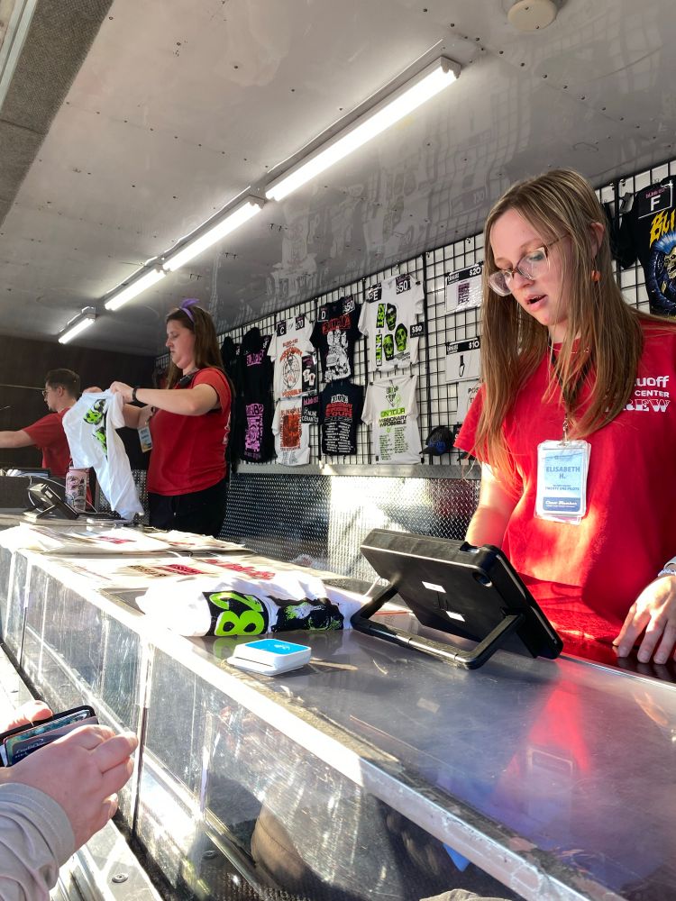 One of the merchandise trailers outside the venue 
$50-$80 poster and tees 