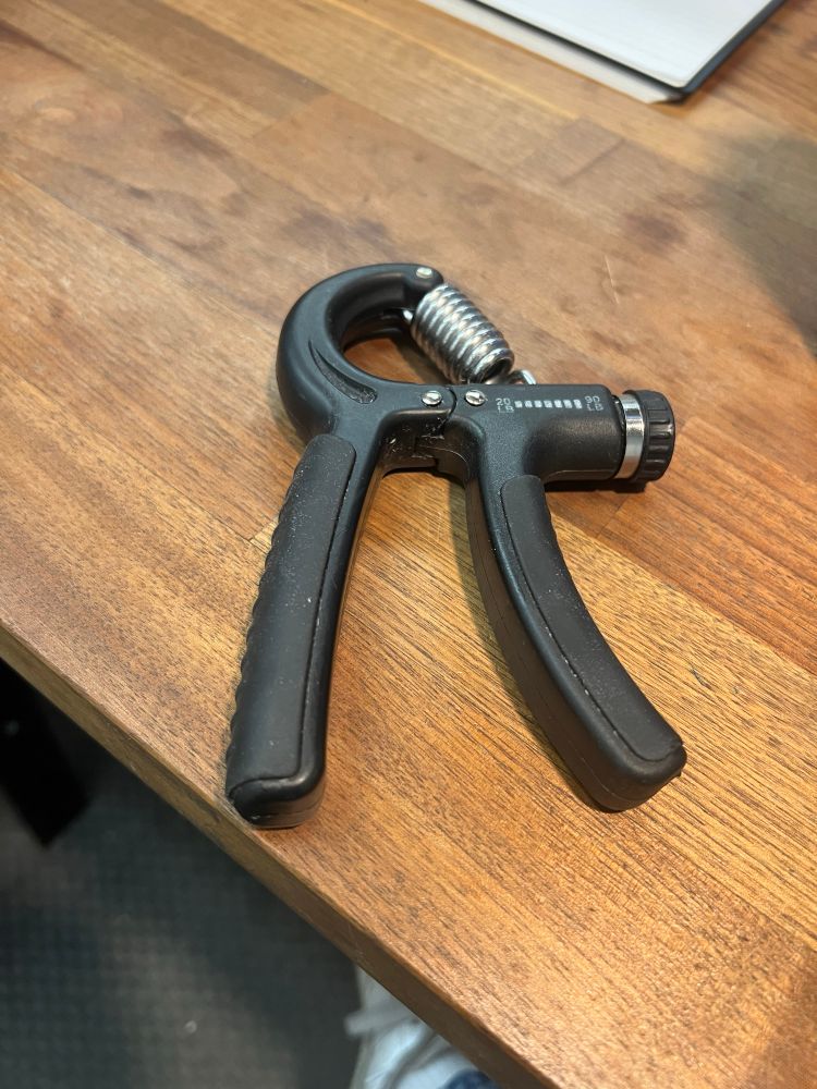 one of those spring loaded grip exercise forearm finger graspy thingys. that you squeeze
