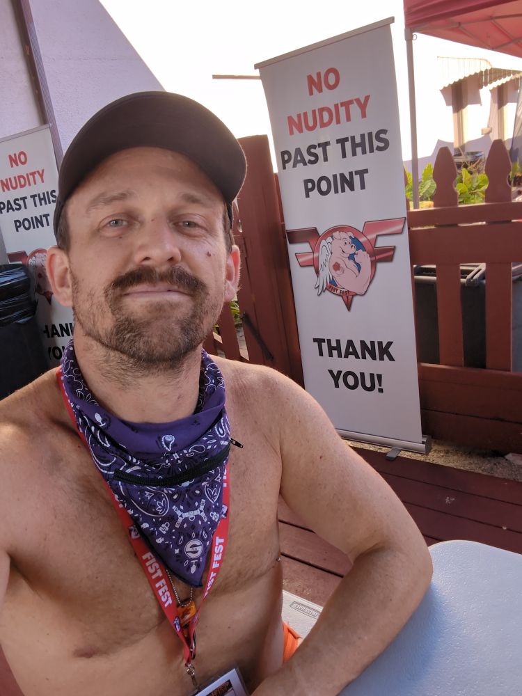 Half naked guy smirking at camera