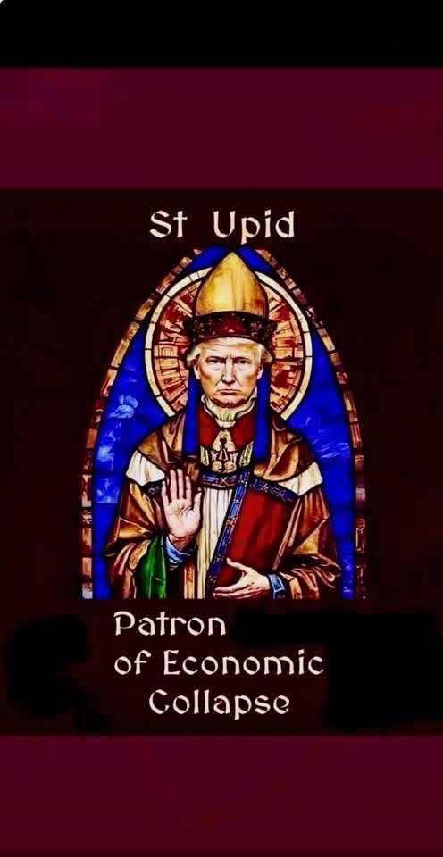 A stained glass portrait of The Orange 🤡 in the style of a saint. The window is called 