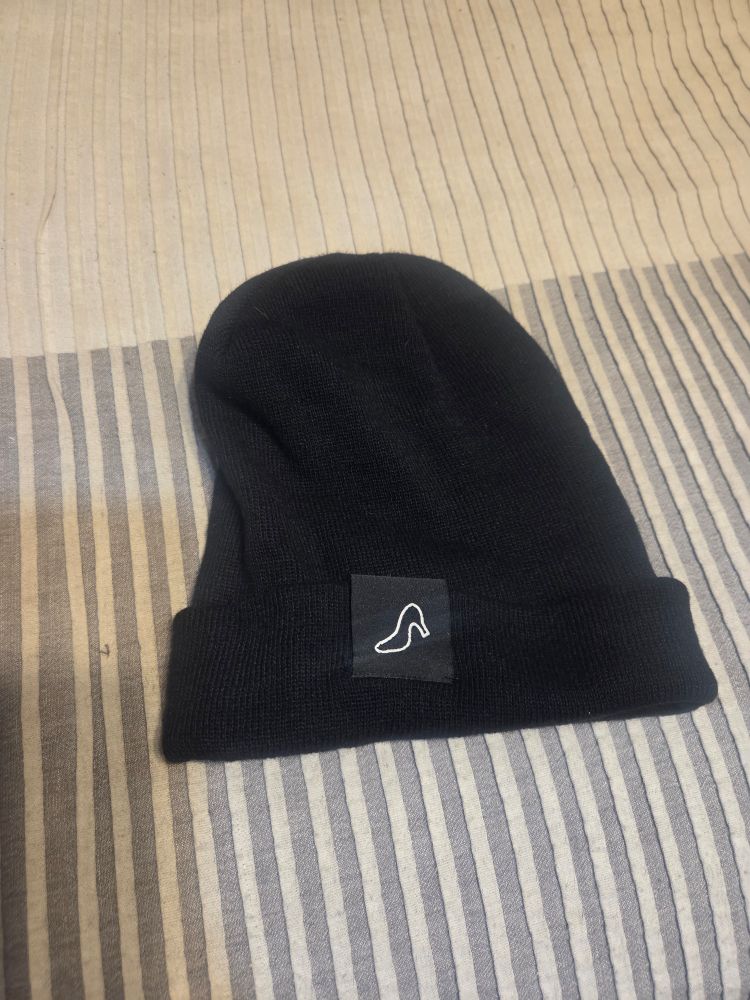 A black Muses beanie.