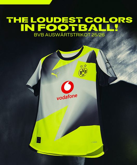 Das Bild zeigt das neue Auswärtstrikot von Borussia Dortmund, ein Mix aus Gelb, Grau und Schwarz. Mit einem rot-weißen Vodafone Logo in der Mitte und gelbem Puma Logo links, bzw. BVB Logo rechts.