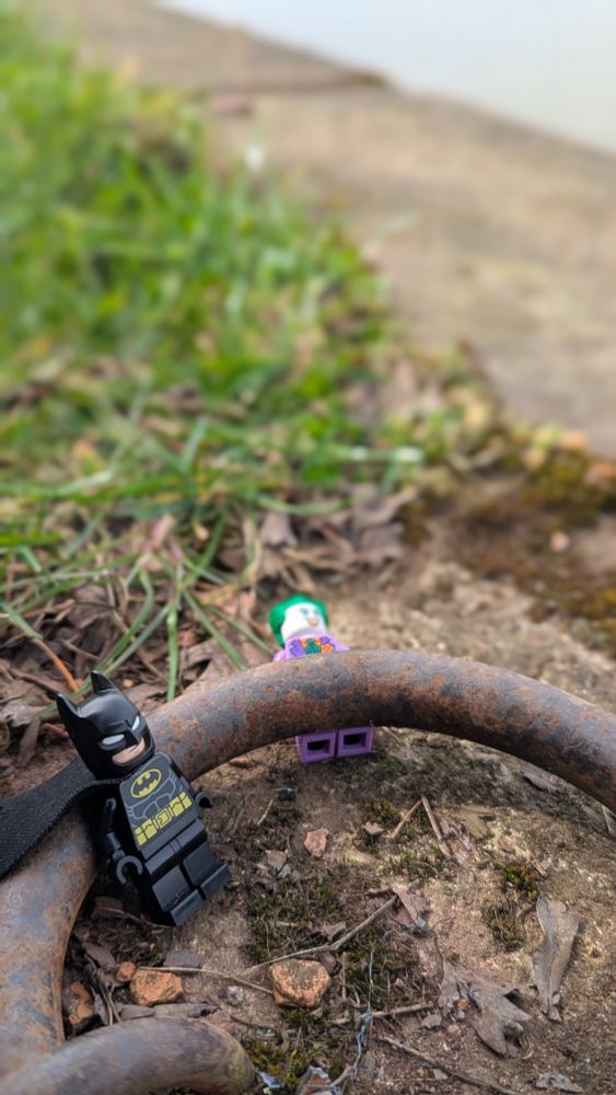 Batman has trapped joker on metal ring used to tie boats up 