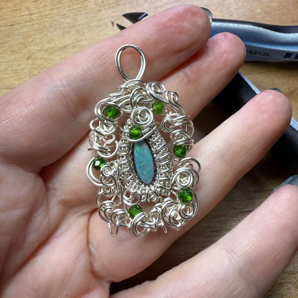 The opal pendant from the previous skeet, now with a LOT of fwooshy wirework. 