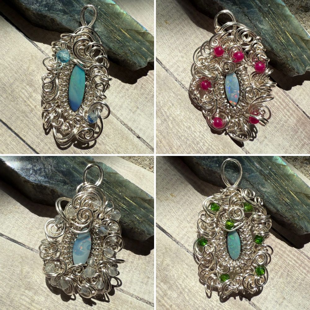 A collage of four photos of pendants made from small oval opal doublets set inside a bezel of coiled wire and surrounded with swirly wire accented with gemstones. There is one with blue-green fire and blue accents, one with multi-color fire and red accents, one that’s mostly white with clear accents, and one with green fire and green accents. 