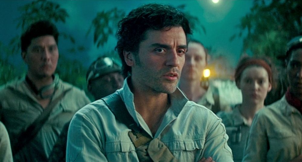 A scene from "Star Wars: Rise of Skywalker", in which Poe Dameron says "Somehow, Palpatine returned", that has since become legendary for lazy writing. It is a largely cold toned night scene with poe from the shoulders up, his collar popped like the cool guy he is, surrounded by comrades in a rebel camp surrounded by greenery. 