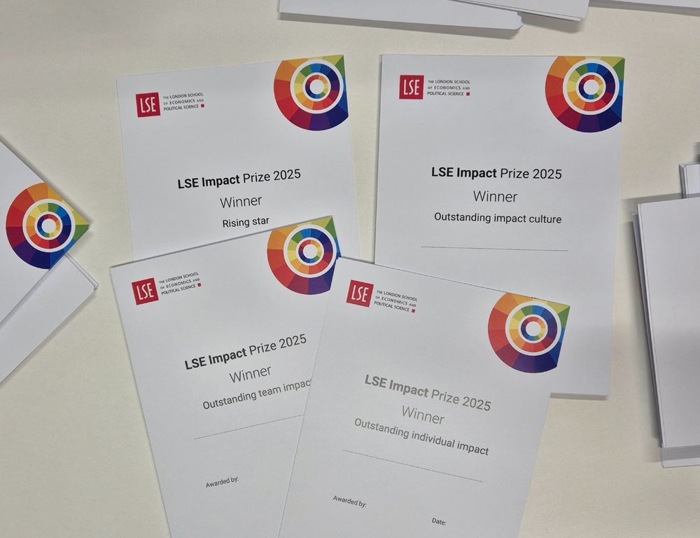 piles of certificates with blank spaces for names, on white paper, with LSE logo and a rainbow logo