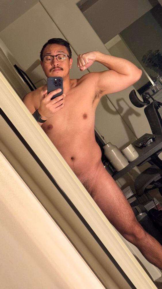 Semi-nude mirror selfie, flexing my bicep and showing a tiny bit of pubes