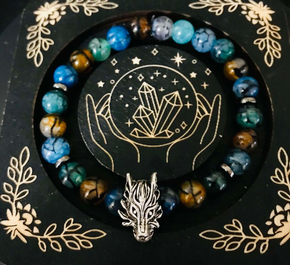 Made with dragon vein agate beads and a silver dragon focal 