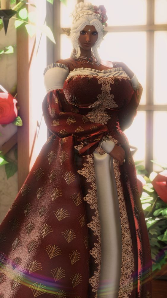 A brown skinned Black elezen woman (my WoL, Gisèle) stands demurely beside the window of her tea salon, bathed in sunlight with roses behind her. She is wearing an elaborate brocade gown of deep, Fortemps red with golden flowers over a white silk chemise. Her hair is tied in a fancy updo with her signature red roses, and she wears fancy golden earrings and a jeweled bindi between her eyes. Her pearl necklace has the unicorn crest of House Fortemps upon it.
