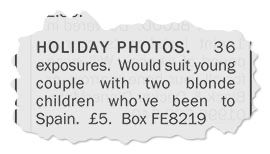 A classified advertisement torn from a local newspaper. The advert reads: “Holiday photos. 36 exposures. Would suit young couple with two blonde children who’ve been to Spain. £5. Box FE8219”