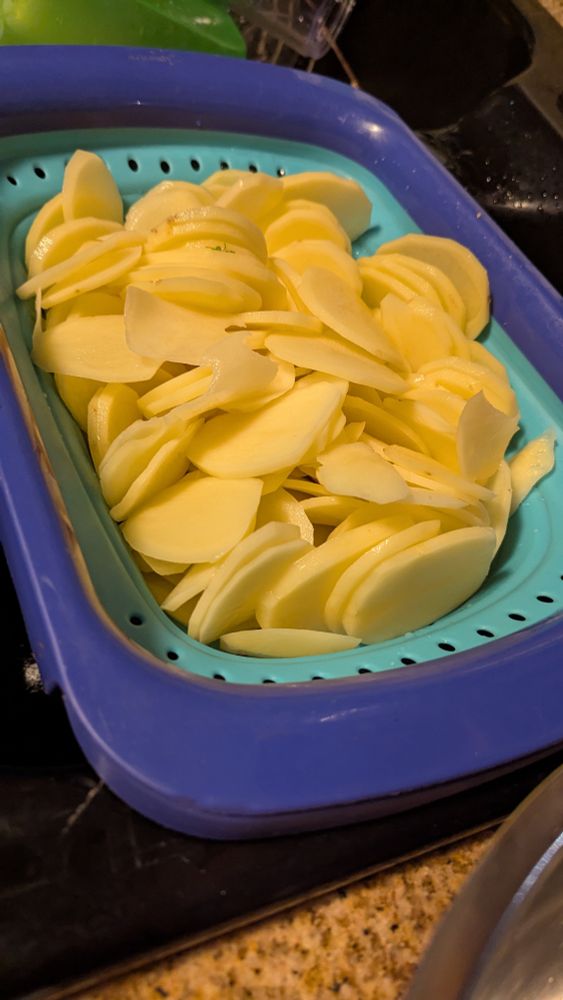 Three lbs of skinned and mandolined Yukon gold taters.