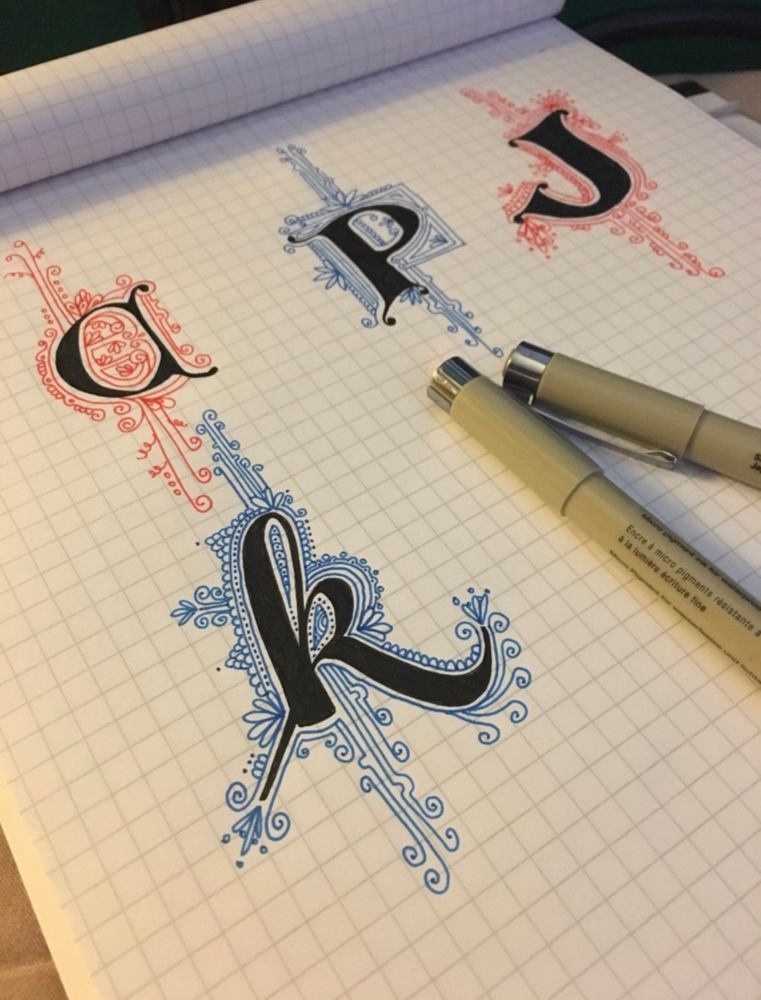 Letters c, p, j, k in black micron pen ink and outlined in red or blue decorative lines and circles 