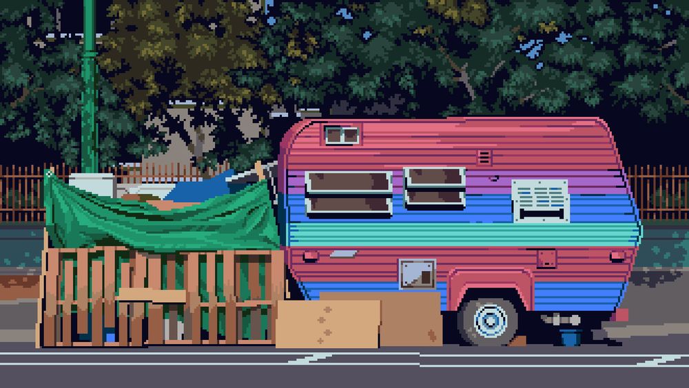 A colorful trailer/RV home (painted in stripes of red, purple, blue, and cyan) sitting on the road. To its left is a makeshift structure made of shipping pallets and a green tarp.  Above the trailer is a canopy of trees with green and yellow leaves.