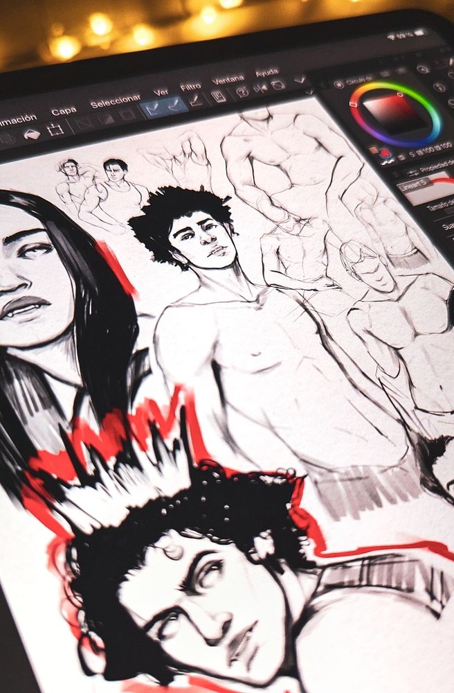 A photo of my ipad screen showing a collection of drawings by me. You can see 8 anatomy sketches (most are "masculine" bodies) and two portraits of vampires. All are black and white but there are some red paint strokes. In the center one of the anatomy studies is a vampire with black hair that looks directly to the camera. The two portraits are black haired too, one with long hair, straight forward, looks like a woman, and the other one a little blurred wears something like a crown. At the back of the photo you can see the yellow lights of my desk.


Una foto de mi ipad con una colección de dibujos míos. Se pueden ver 8 bocetos de estudios de anatomía (la mayoría cuerpos "masculinos") y dos retratos de vampiros. Todos son en blanco y negro pero hay algunos trazos en roja. En el centro uno de los estudios de anatomía es un vampiro de pelo negro que mira directamente a la cámara. Los dos retratos también son de pelo negro, uno con el pelo largo, mirando de frente, parece una mujer, y el otro un poco borroso lleva algo parecido a una corona. Al fondo de la foto se ve las luces amarillas de mi escritorio.