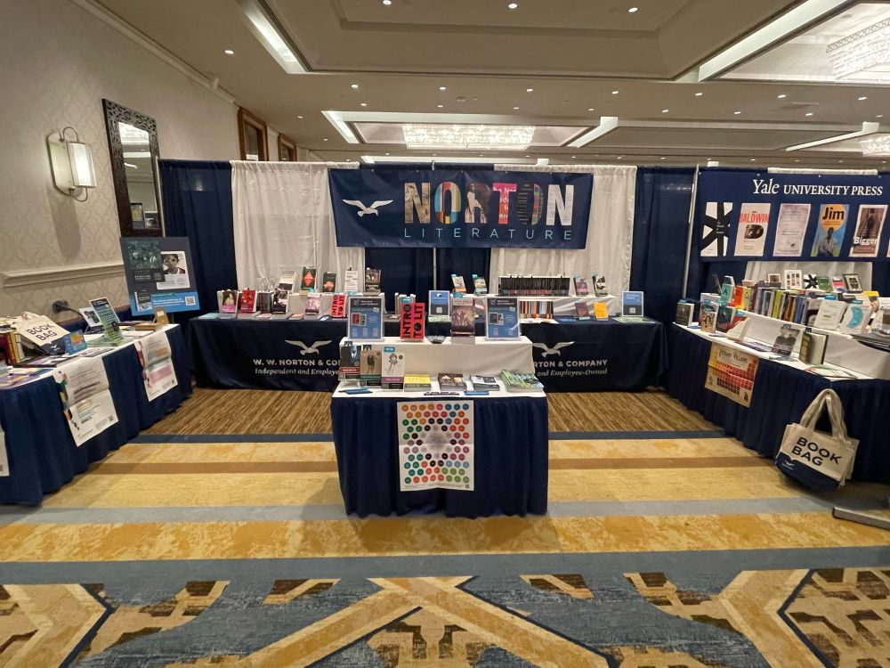 W. W. Norton booth at MLA featuring Norton Critical Editions, Norton Library titles, Norton Anthologies, and more