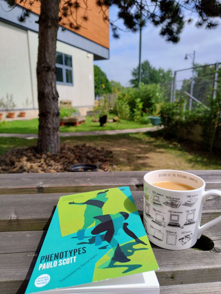 A well earned mug of tea and a book in the staff garden at Oldham Library.