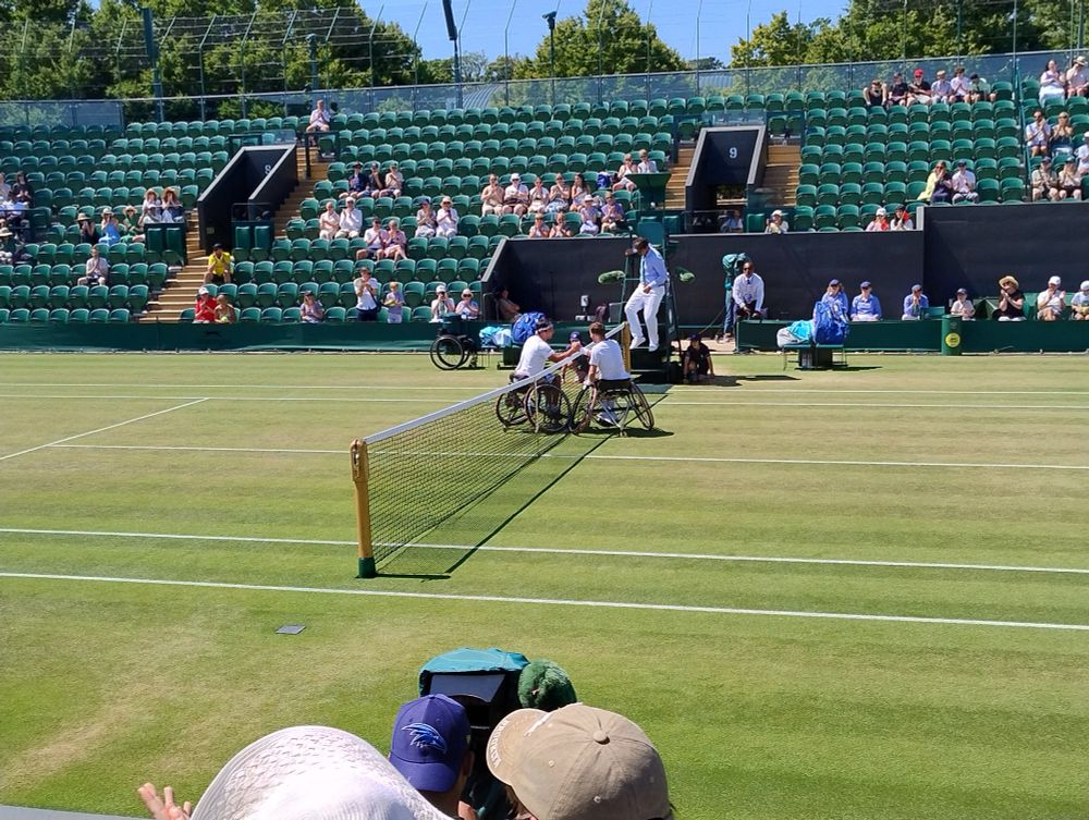Alfie Hewitt and Ji Zhenxu shake hands at the end their Wimbledon Men's Wheelchair Singles Quarter Final.