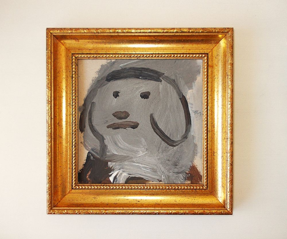 Image shows a gold-framed painting of a grey dog with long ears and a small wig.