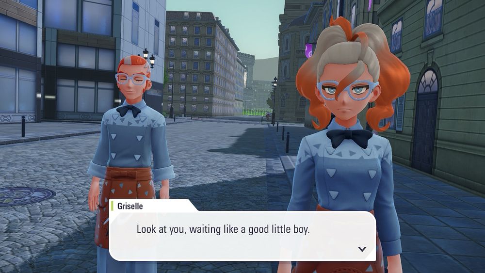 A screenshot of Pokemon Legends Z-A, showing the two employees of the Nouveau Cafe, Griselle and Grisham. Griselle is speaking, with the text “Look at you, waiting like a good little boy” on the bottom of the screen.