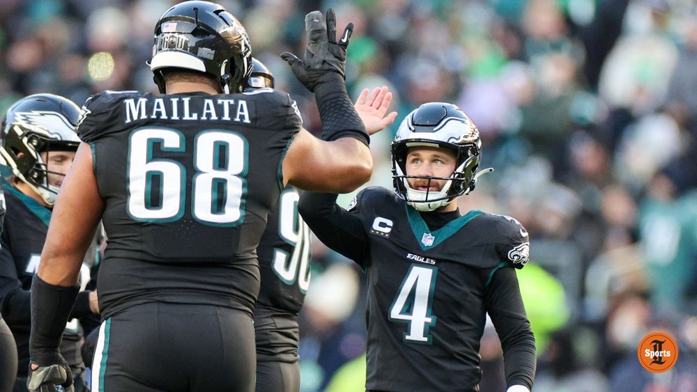 A photo of Jake Elliott celebrating a field goal.