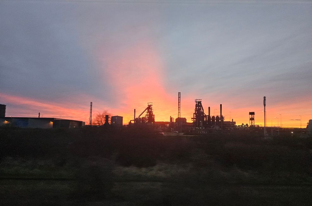 Sunset over a refinery in Port Talbot, UK