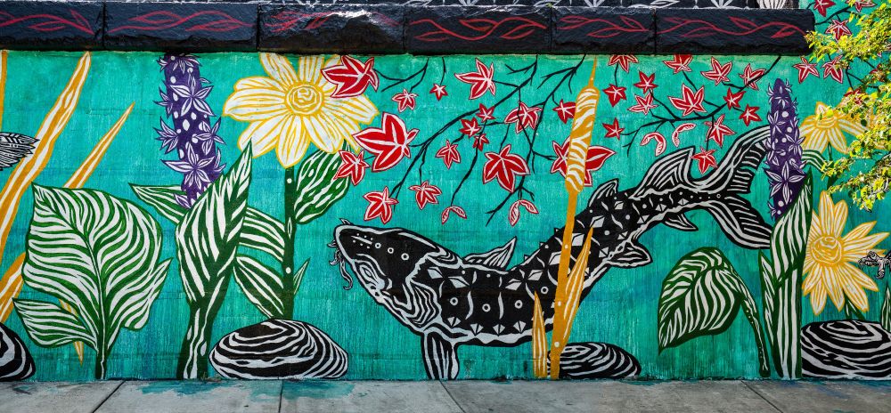 A public mural of fish and flowers