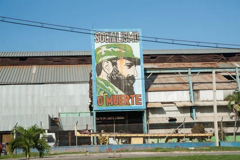 Cuban dictator Castro's picture displayed on a building.
