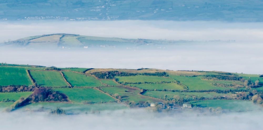 Photo shows fog lying low over the fields of Donegal and Tyrone. 