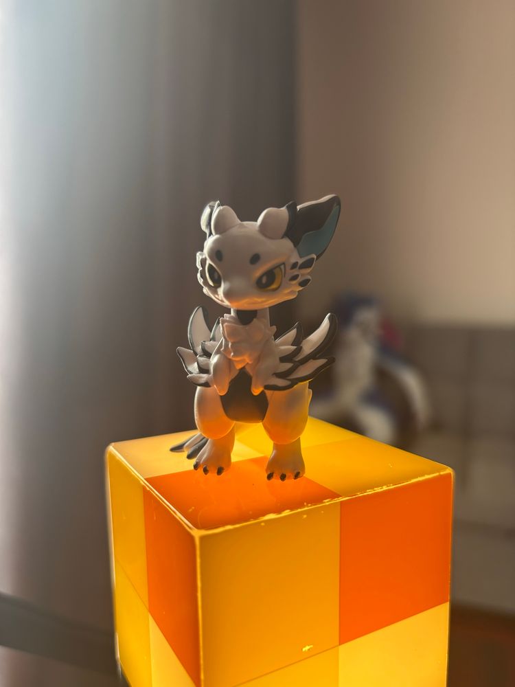 Small dragon figure by K-line on a minecraft torch