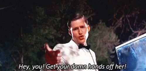 George McFly in Back To The Future opening a car door and saying to Biff, "Hey you! Get your damn hands off her!"