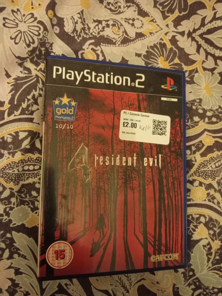 Resident Evil 4 for the PS2, with a £2 sticker on it.