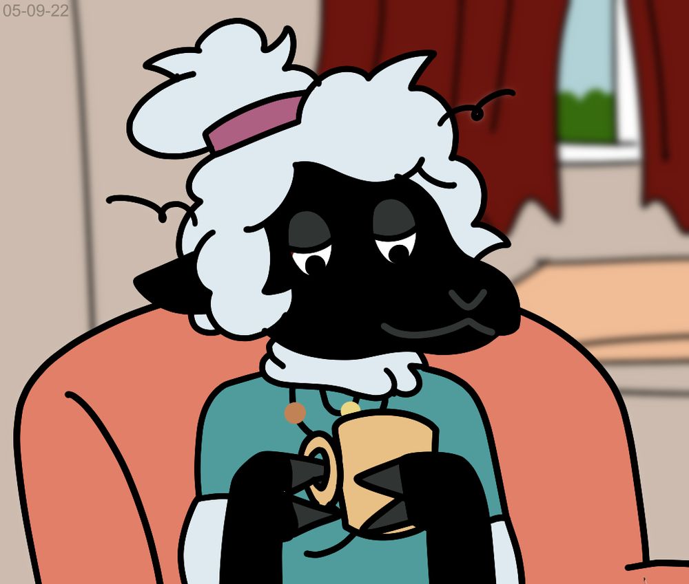 Black sheep drinking coffee while sitting in couch.