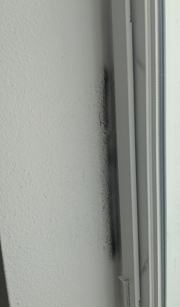 Grime deposited on drywall window jamb through a trickle vent in an apartment in Seattle. 