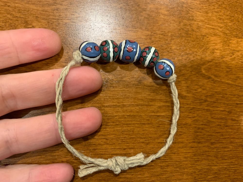 Blue red and white patterned beads made into a bracelet 