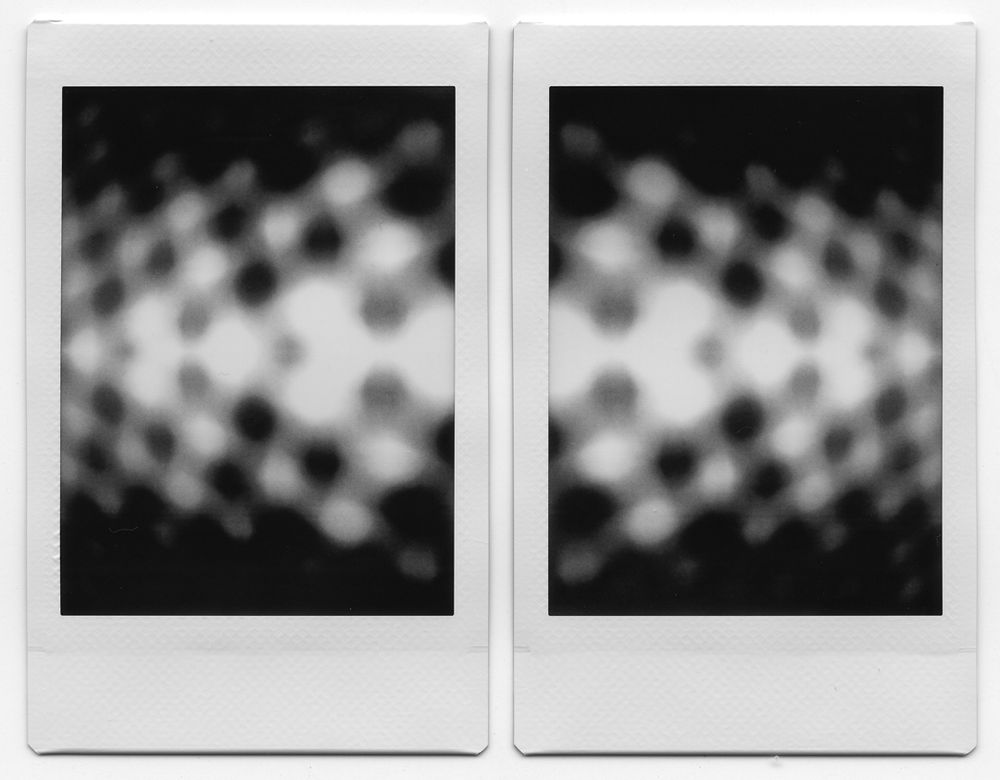 

A pair of abstract black and white instant photos, blurred beyond recognition and extremely grainy, that somewhat resemble multiple arrows pointing away from one another.