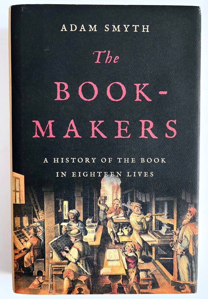 A book jacket with the main titles printed in red on a a black background. Below it is a color illustration of a busy early printing shop. Ten workers are crowded into a small space. selecting & setting type, working with a large press, proofreading, etc.