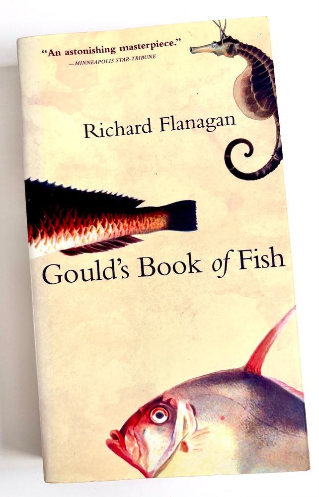 Book cover with the title 'Gould's Book of Fish, plus the author's name. Three fish swim across the cover, including a seahorse.