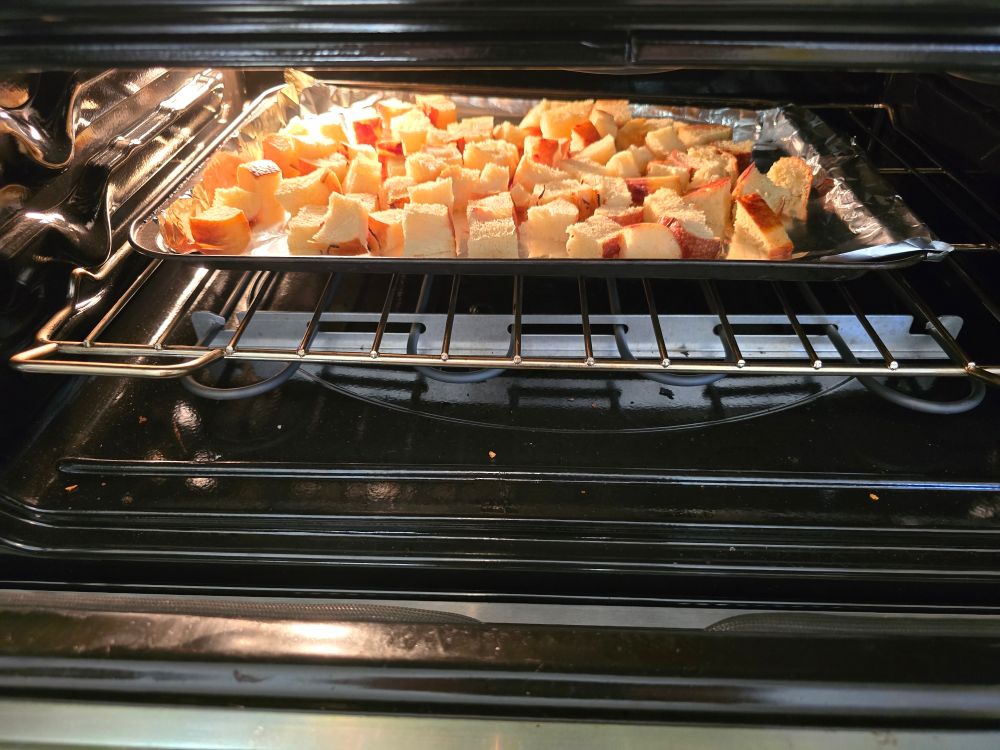 Onion loaf tuto bread, slowly being toasted into croutons. 