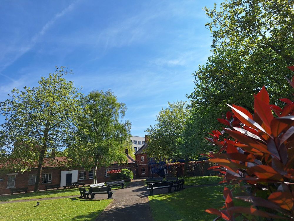Image shows Milldam Quad under a blue sky 