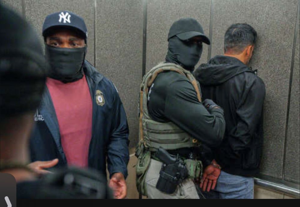 US ICE agents wearing masks to hide their identity as they break the law and infringe constitutional rights, ignoring due process, arresting a brown person for being brown.
