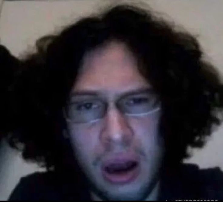 Ray Toro from American rock band My Chemical Romance is looking down the camera looking shocked/disgusted