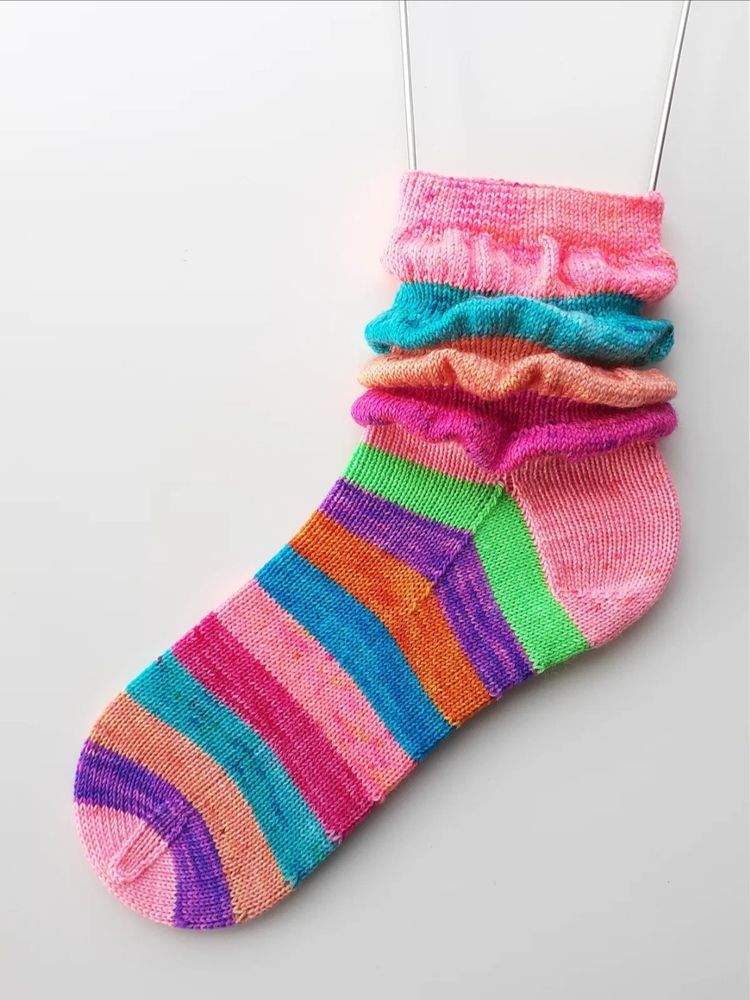 Colourful knitted socks with ruffle details on the cuffs