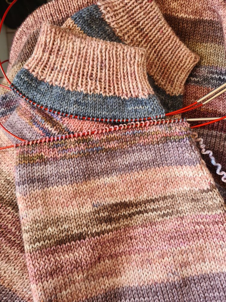 Knitting surgery on a sleeve of a sweater