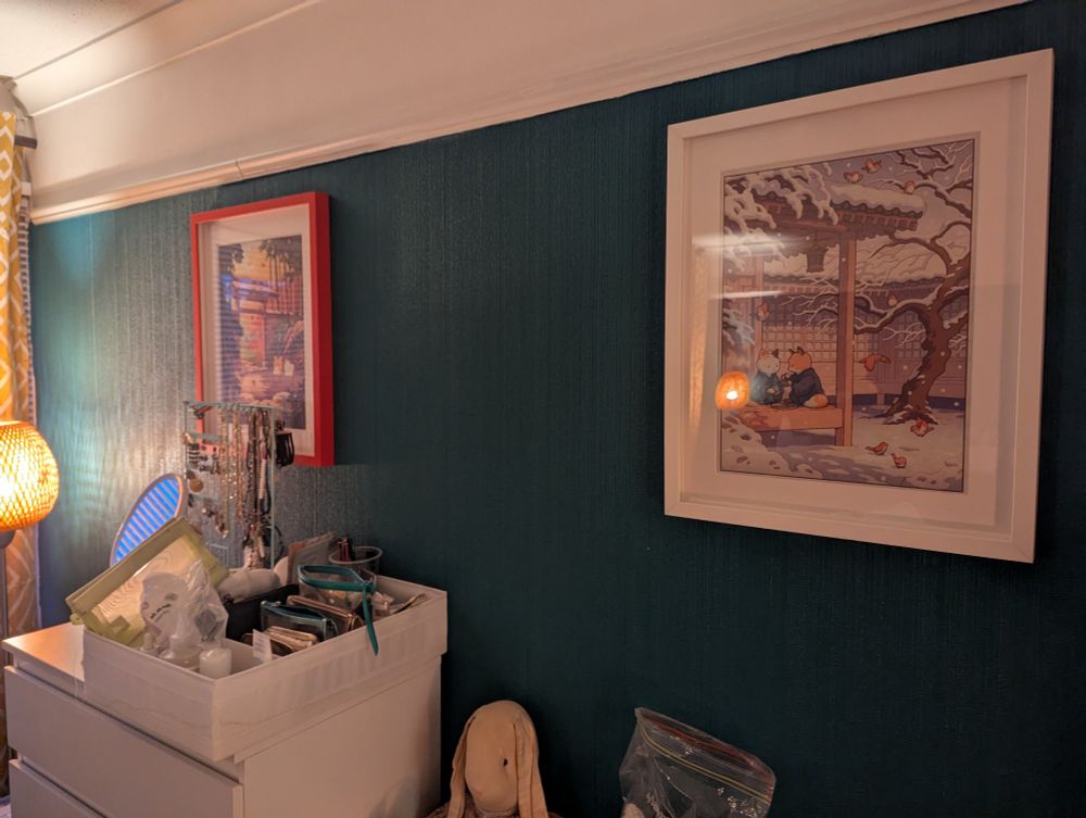Fox and Cat, in autumn and winter, framed on a wall
