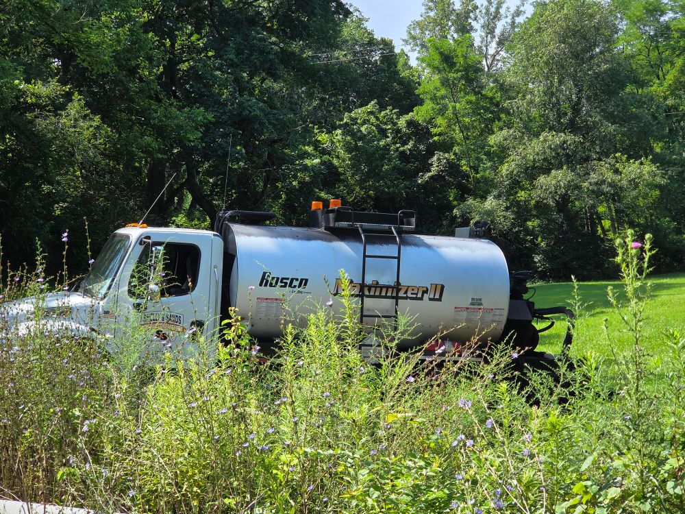 An industrial liquids truck says "MAXIMIZER II"