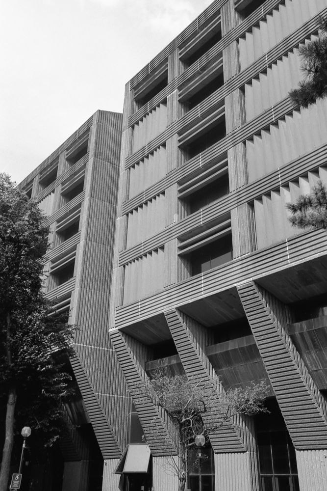 Photo of the west side of a brutalist building (a Verizon office) on Main Street in White Plains, NY. The day was somewhat hazy and the contrast is a bit flat. Meh.