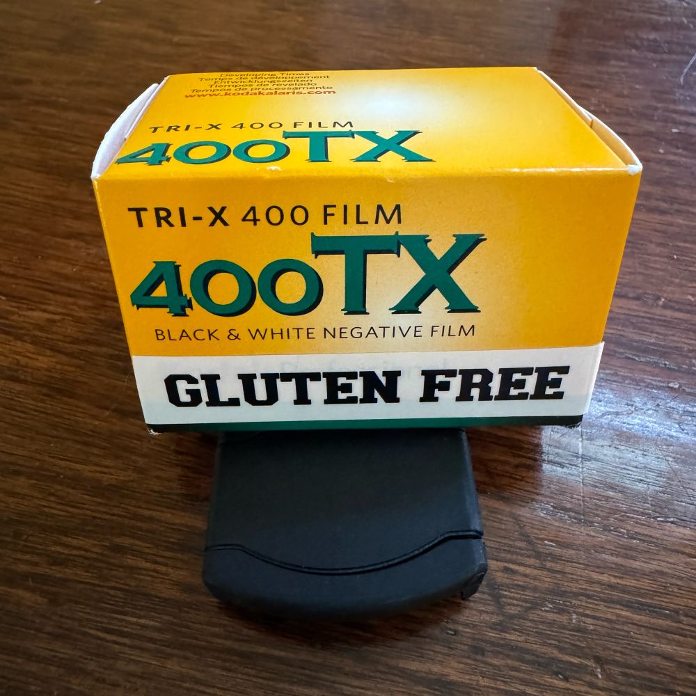 A box of Tri-X film with a printed label declaring it gluten free. 