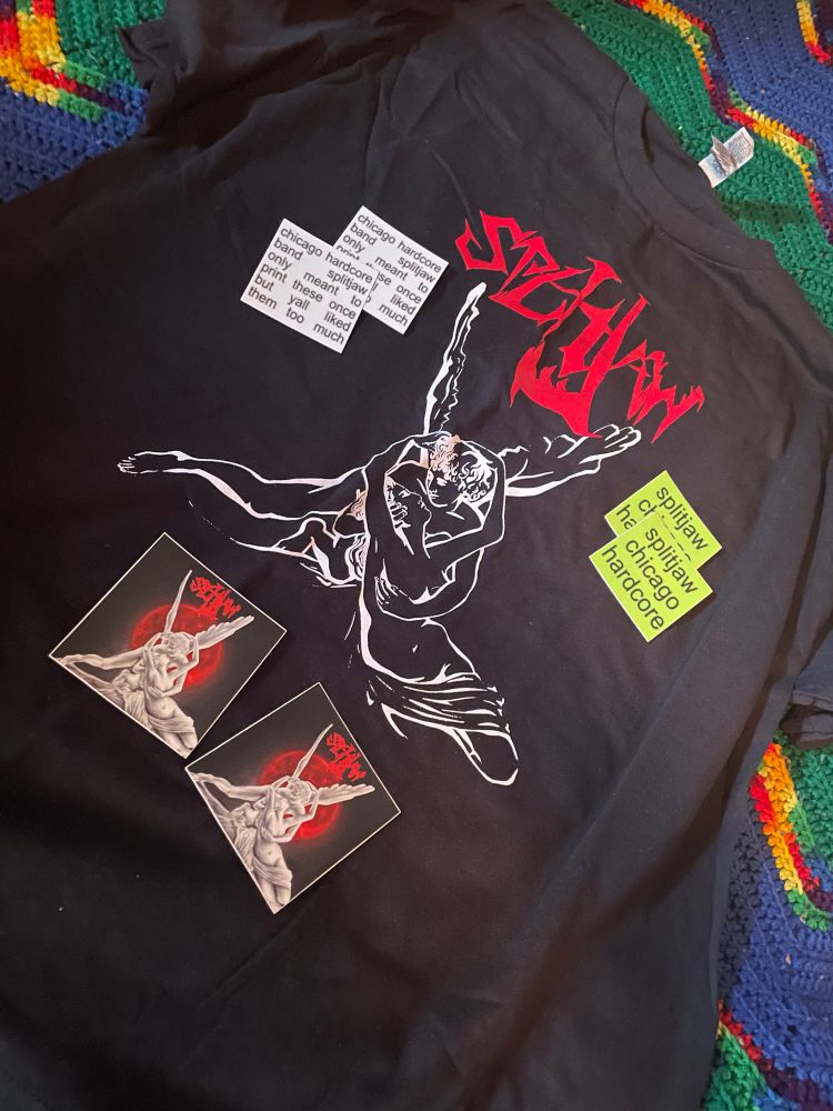 a t shirt and several stickers 