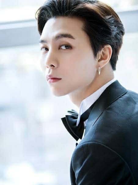Johnny in a tux, looking over his shoulder at you
